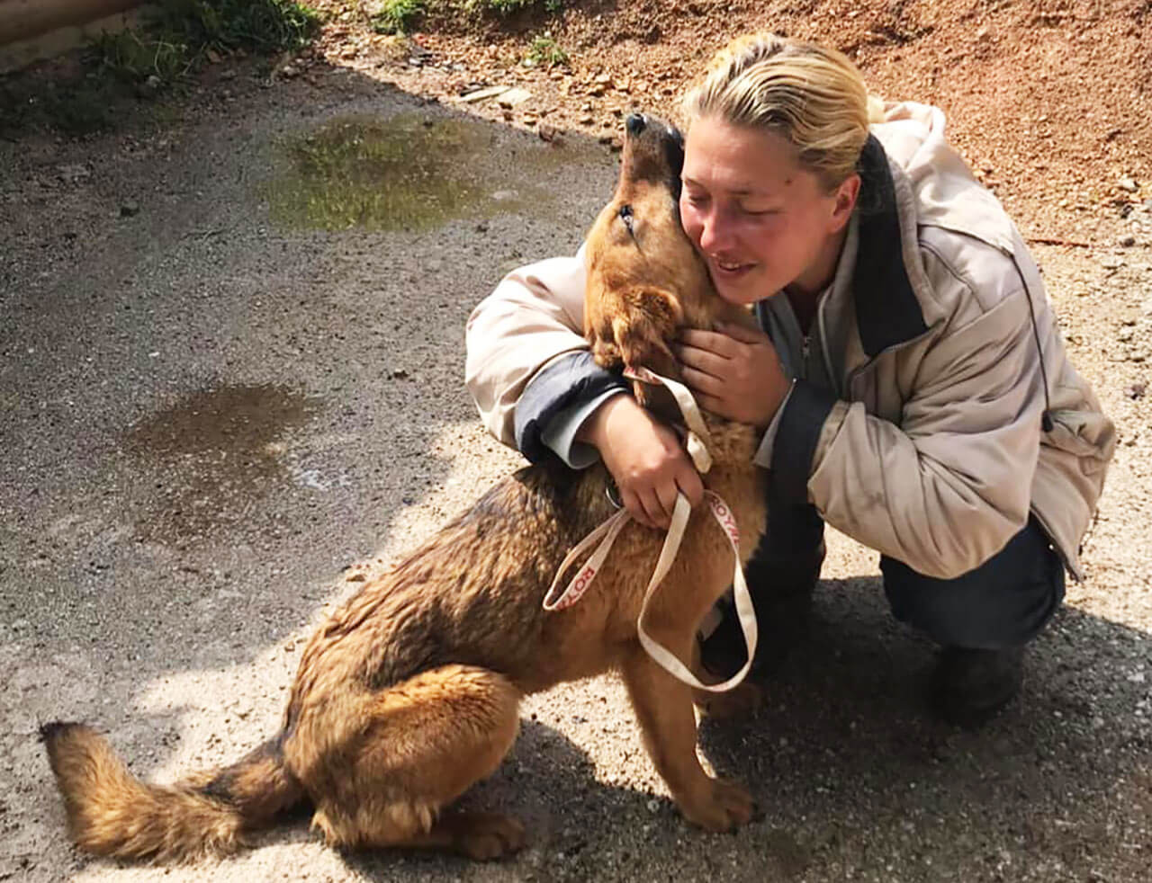 Nadia hugging rescued dog